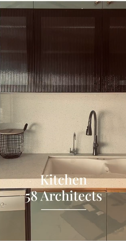 Modern living room interior design with sectional sofa, large windows and city view in Mumbai apartment